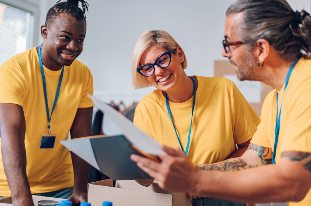 Group of multiracial volunteers working in community charity don