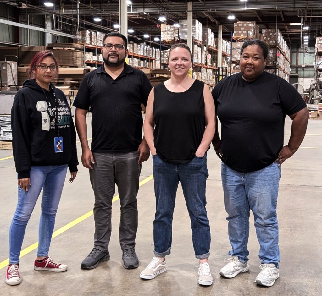 Workers standing in a warehouse