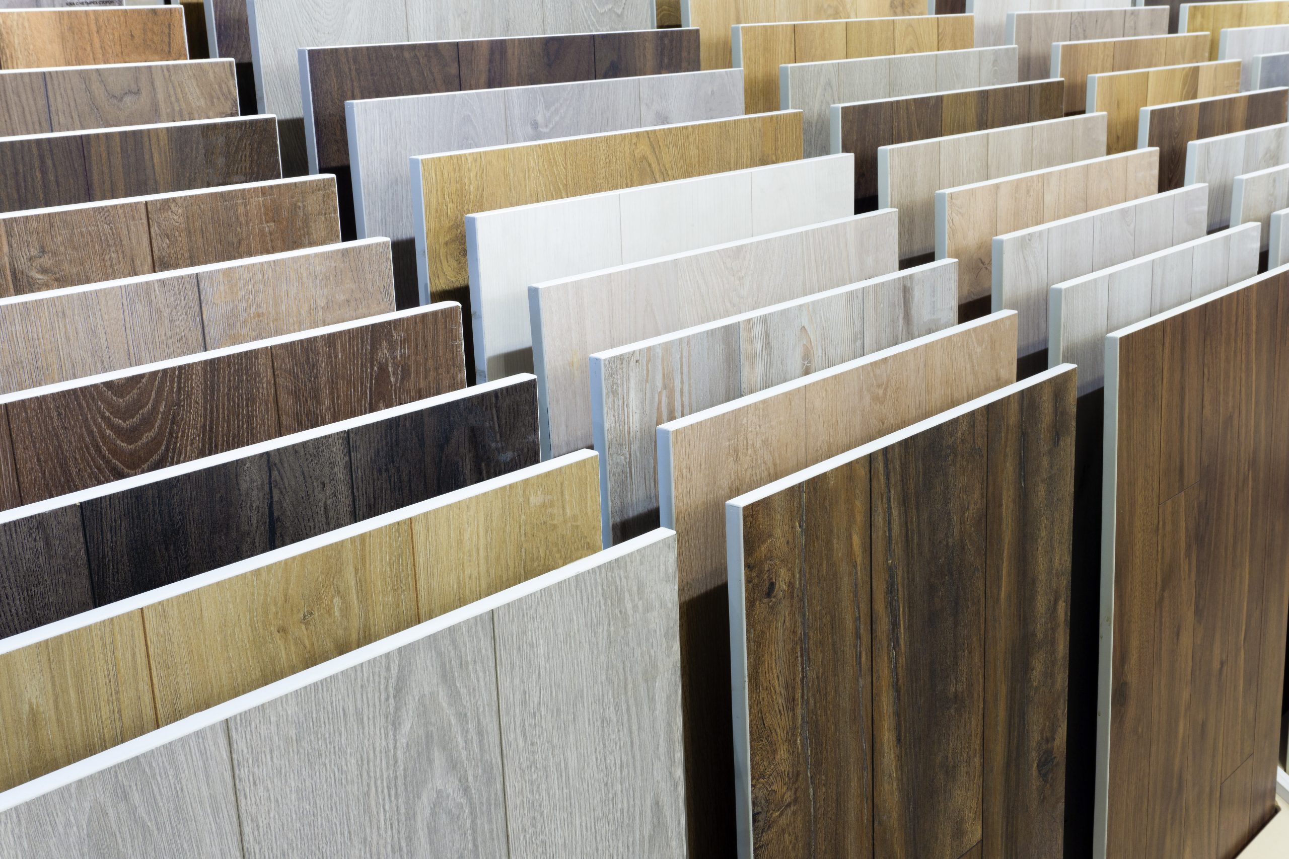 Laminate background. Samples of laminate or parquet with a pattern and wood texture for flooring and interior design. Production of wooden floors