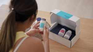 Young asia people woman buy custom tailor made anti aging pill bottle diet immune plan online health care shop open gift box weight loss herbal. Unbox order store clinic home service life balance.